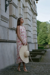 a lady in a floral printed off the shoulder dress